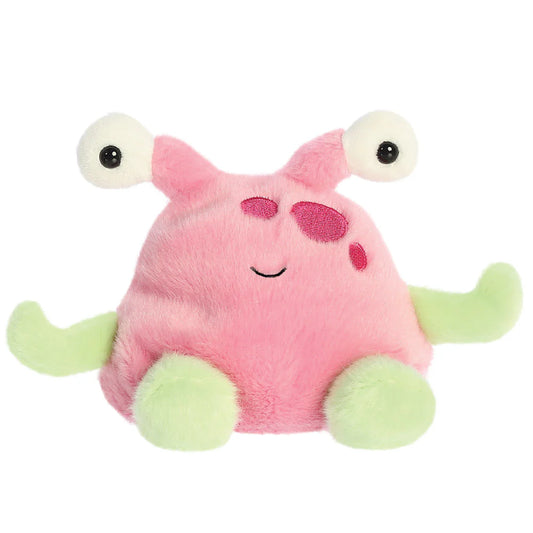 Pink plush toy with googly eyes and green legs on a white background