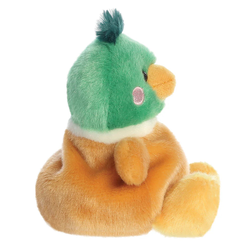 Plush toy with a green hat and orange body on a white background