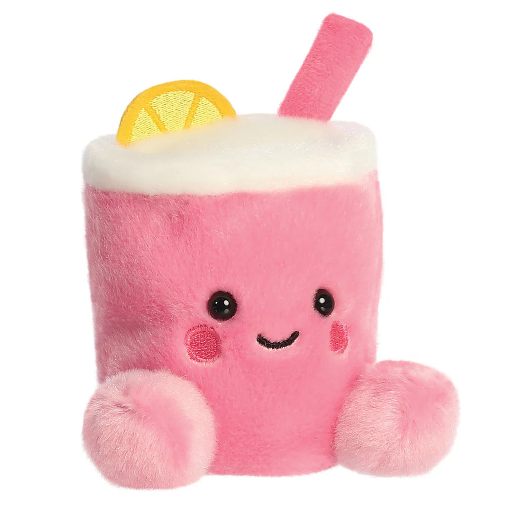 Plush toy resembling a pink drink with a lemon slice and straw on a white background