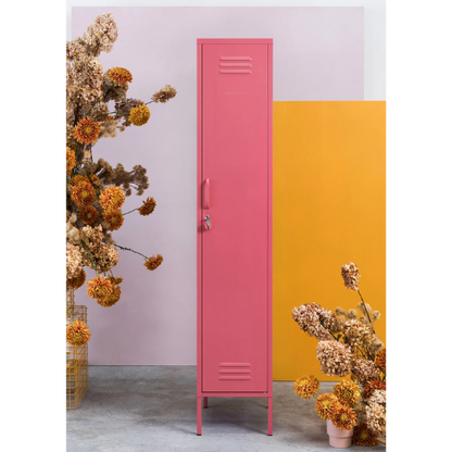 Pink locker with dried flowers on a colorful background