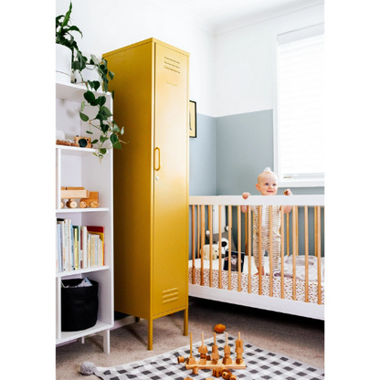 Yellow locker in a child's room with a crib and books on a shelf.