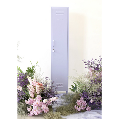 Light purple door with floral decorations on a white background