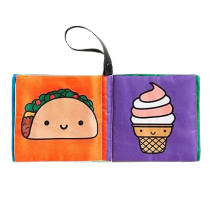 Fabric book with a taco and ice cream cone on orange and purple pages.