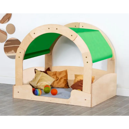 Children's play area with wooden arch, green fabric, and colorful toys on a tiled floor.
