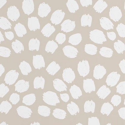 Pattern of white brush strokes on a beige background
