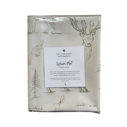 Packaged splash mat with deer and nature design on a white background