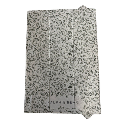 Folded blanket with leaf pattern and 'Ralphie Bear' branding on a white background