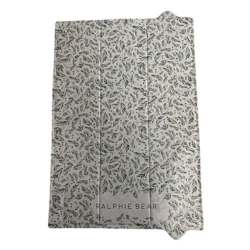 Folded blanket with leaf pattern and 'Ralphie Bear' branding on a white background