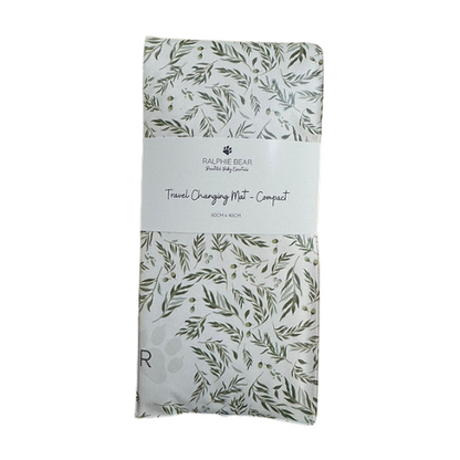 Packaged travel changing mat with leaf pattern on a white background