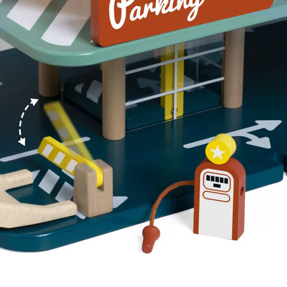 Toy parking garage set with a gas pump and arrows indicating directions.