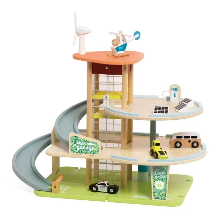 Wooden toy town with buildings, cars, and a slide on a white background