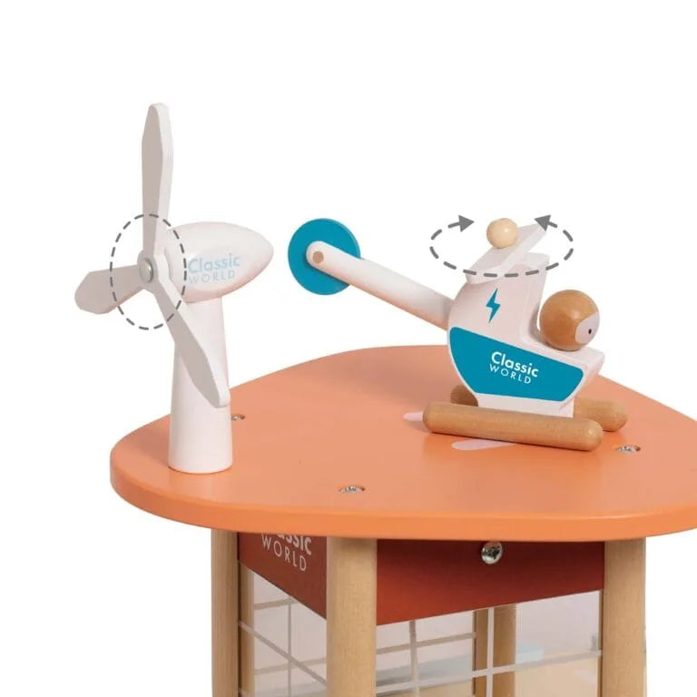 Toy windmill and other mechanical models on a wooden table with 'Classic World' branding.