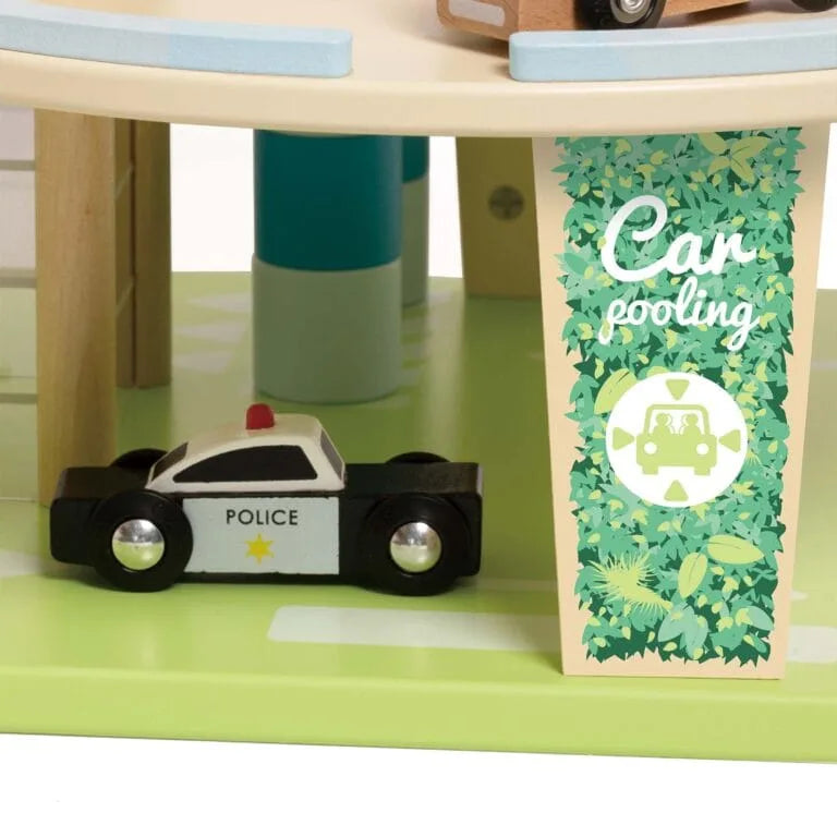 Toy police car on a green surface next to a wooden block with 'Car Pooling' text and design.
