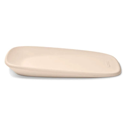 Beige ceramic plate on a white background