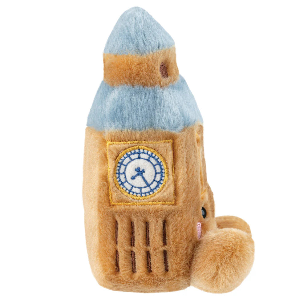 Plush toy resembling a rocket with a clock design on a white background