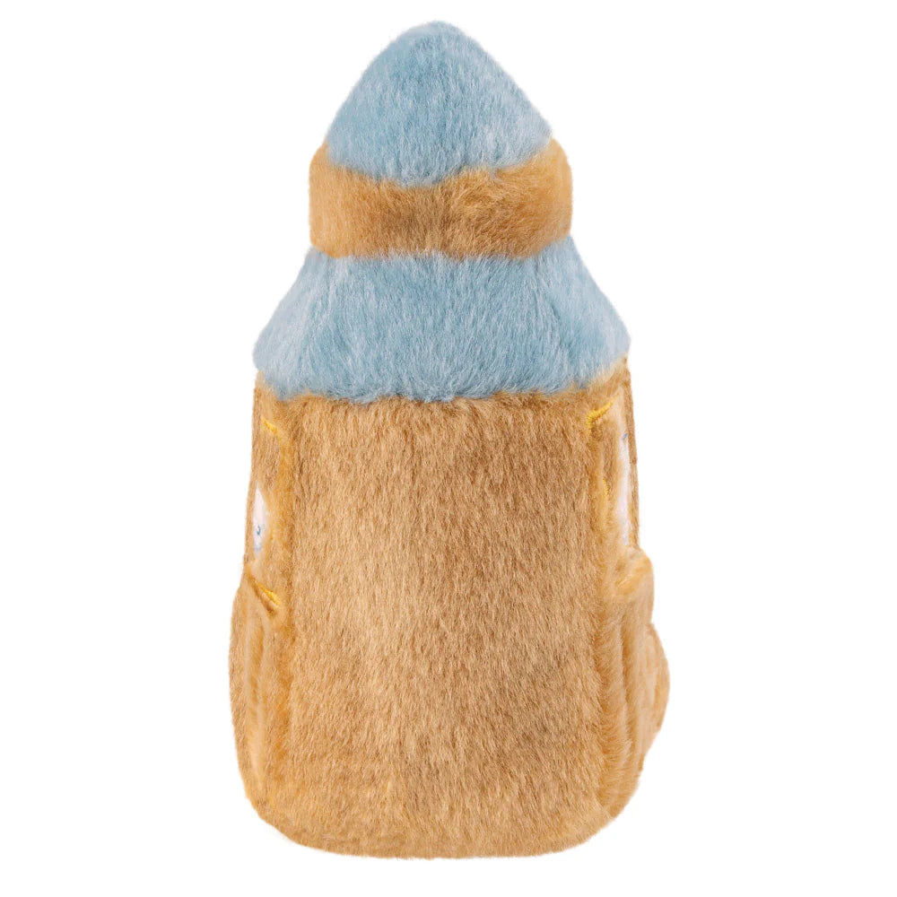 Plush toy resembling a rocket with a blue top and brown body on a white background