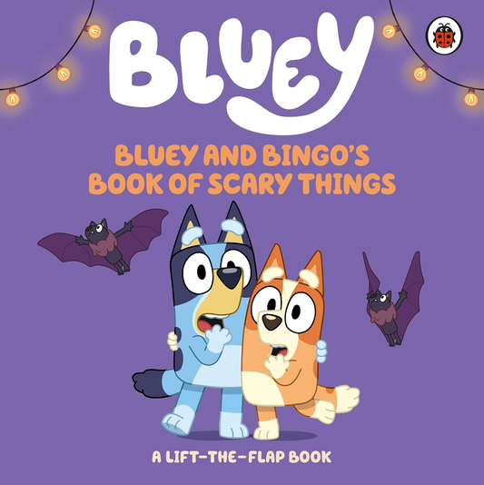 Front cover of the children's book 'Bluey and Bingo's Book of Scary Things' on a purple background, featuring the Bluey characters Bluey and Bingo, two bats, and the title in large white and orange text.