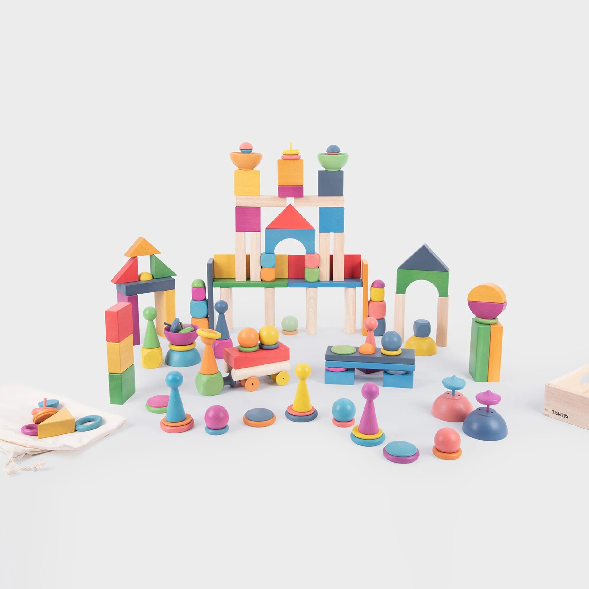 Colourful wooden building blocks on a white background
