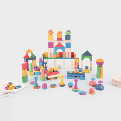 Colourful wooden building blocks on a white background