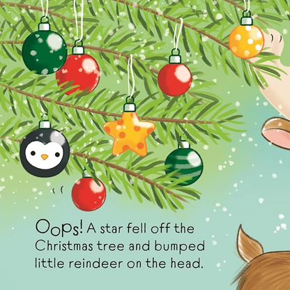 Illustration of a reindeer under a Christmas tree with ornaments and text.