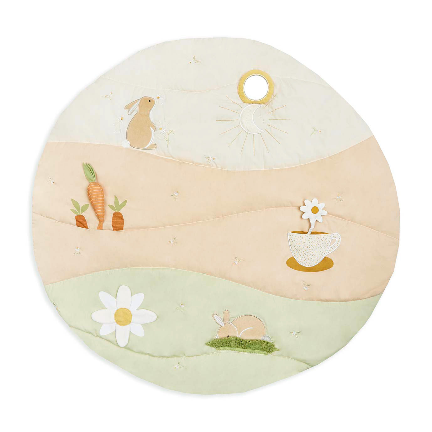 Round cushion with embroidered designs of bunnies, carrots, and flowers on a white background