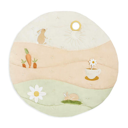 Round cushion with embroidered designs of bunnies, carrots, and flowers on a white background