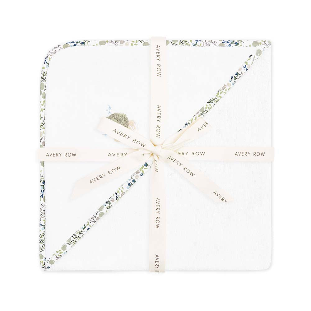 Necklace with floral design and 'Avery Row' branding on a white background