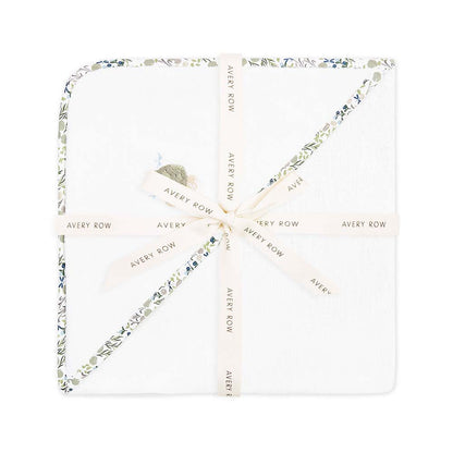 Necklace with floral design and 'Avery Row' branding on a white background