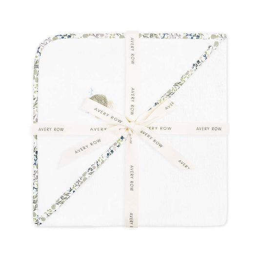 Necklace with floral design and 'Avery Row' branding on a white background