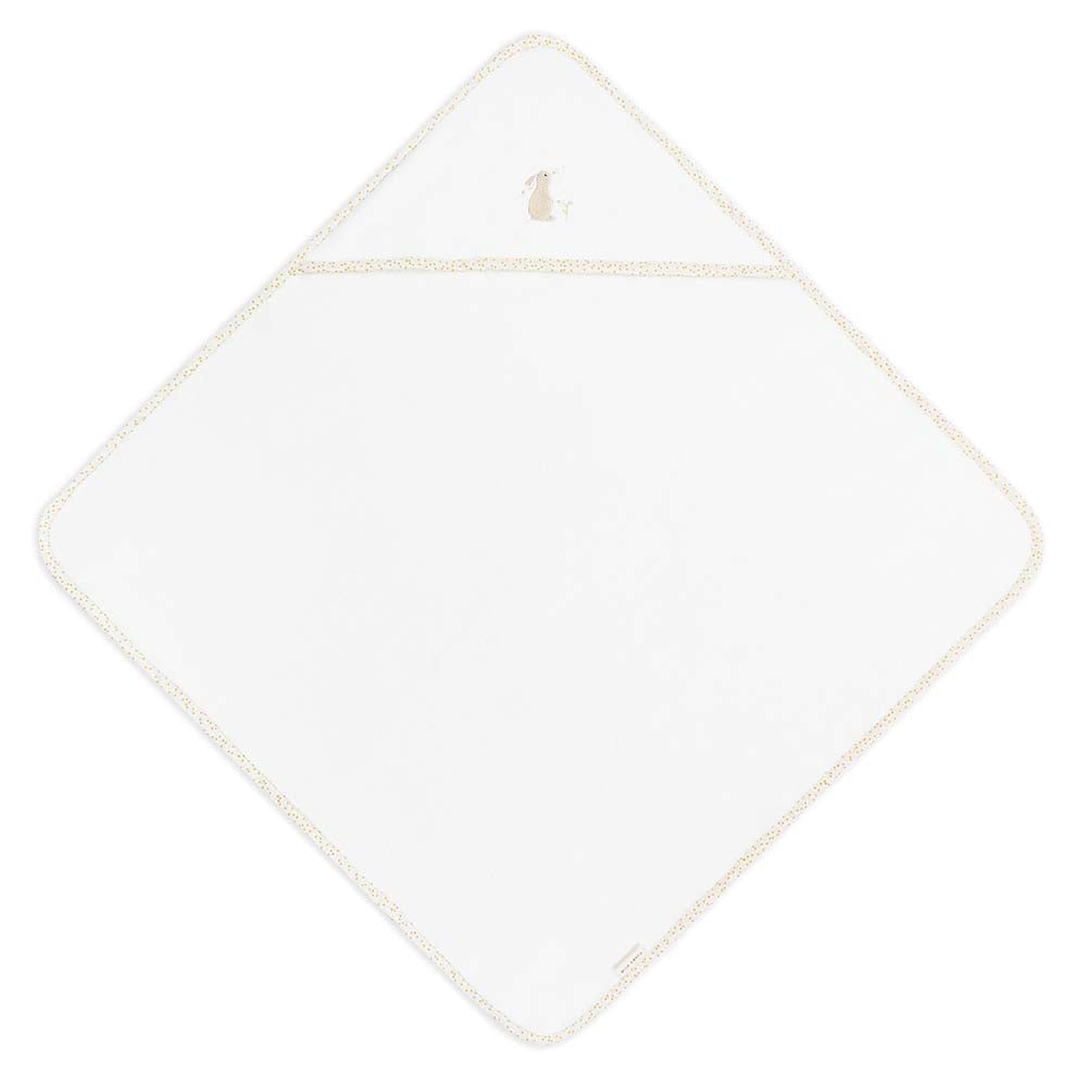White diamond-shaped towel with gold trim on a white background