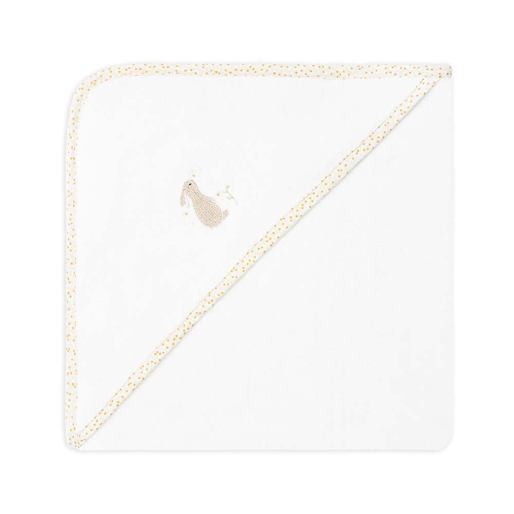 White towel with gold trim and embroidered design on a white background