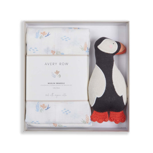 Baby gift set with swaddle and penguin rattle in a box, featuring the brand 'Avery Row'.