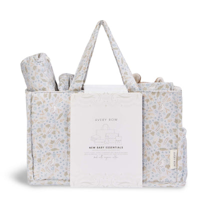 Floral-patterned baby gift set with a tote bag, blanket, and rolled item on a white background.