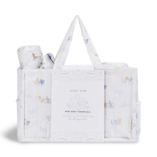 Baby gift set with a tote bag and wrapped items on a white background