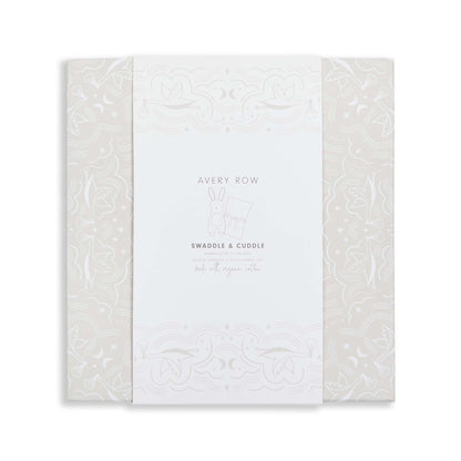 White baby blanket with subtle pattern and 'Avery Row' branding on a white background