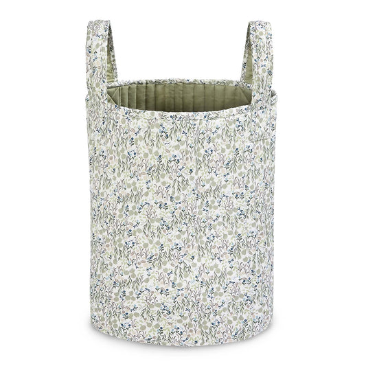 Floral-patterned laundry basket on a white background