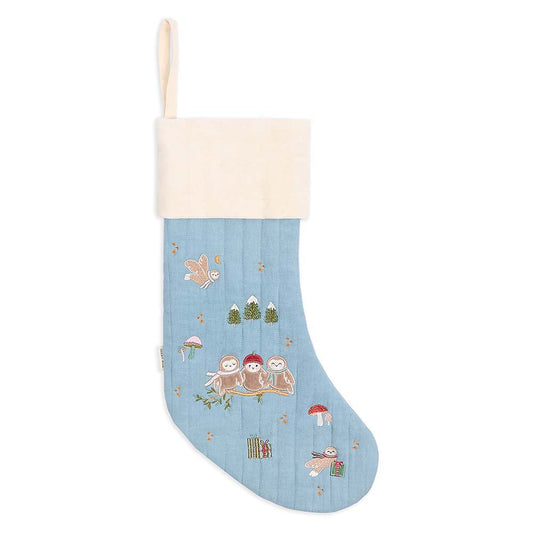 Blue Christmas stocking with winter-themed design on a white background