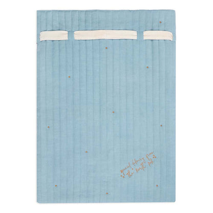 Blue textured blanket with white trim and embroidered text on a white background