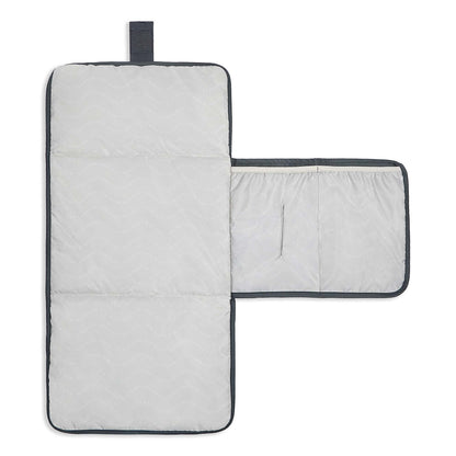 Gray quilted mat with a black border on a white background