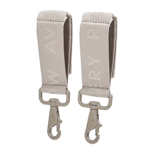 Two beige straps with metal hooks on a white background