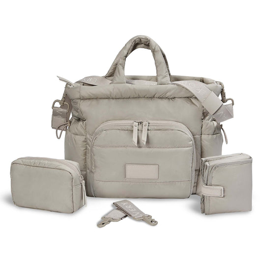Beige diaper bag set with multiple pouches and a shoulder strap on a white background