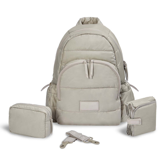 Beige backpack with matching pouches and straps on a white background
