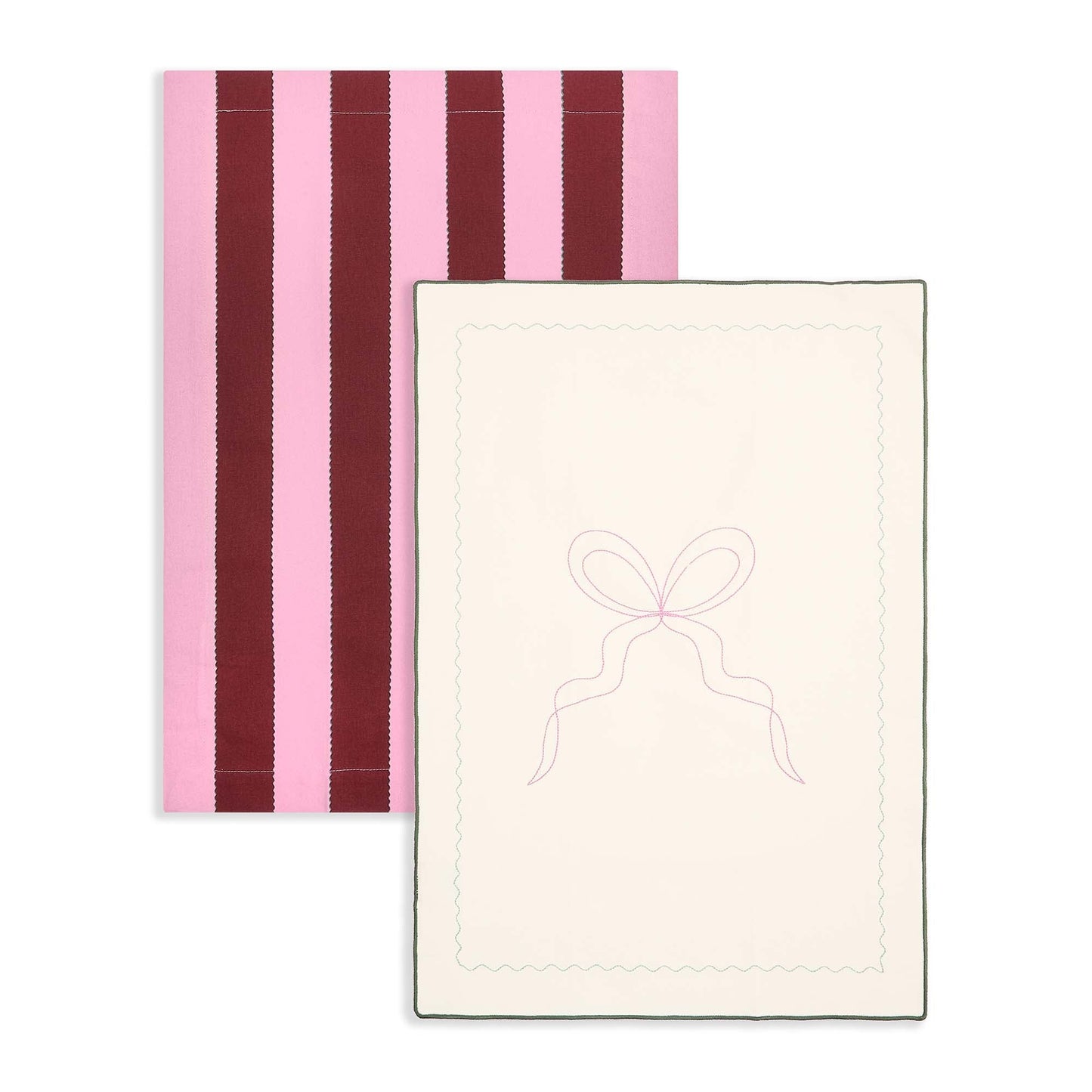Two towels, one with pink and purple stripes and the other with a bow design on a white background.