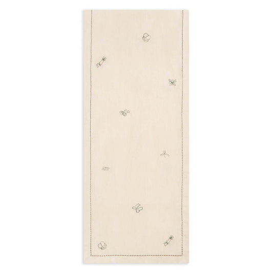 Beige table runner with embroidered butterfly designs on a white background