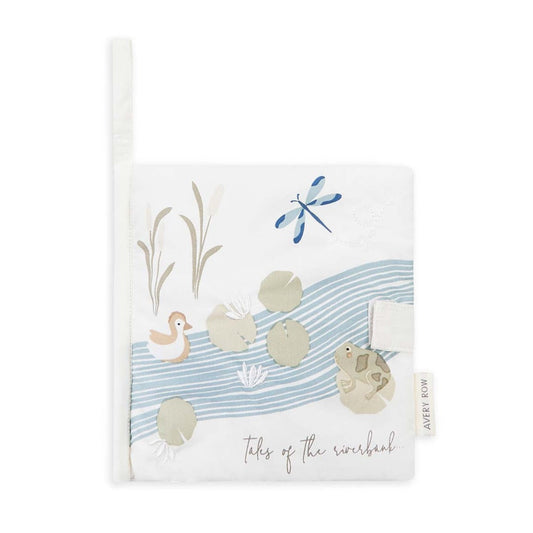 Notebook with riverbank design featuring a duck, dragonfly, and sandcastles on a white background.