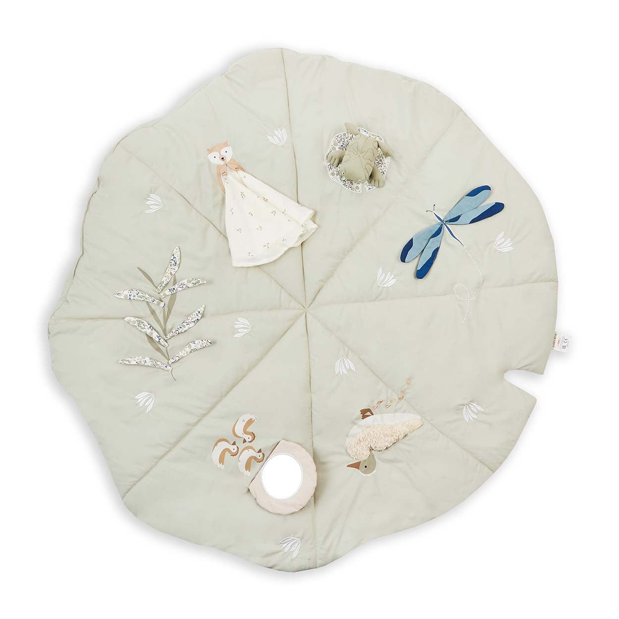 Round quilted baby mat with embroidered designs on a white background