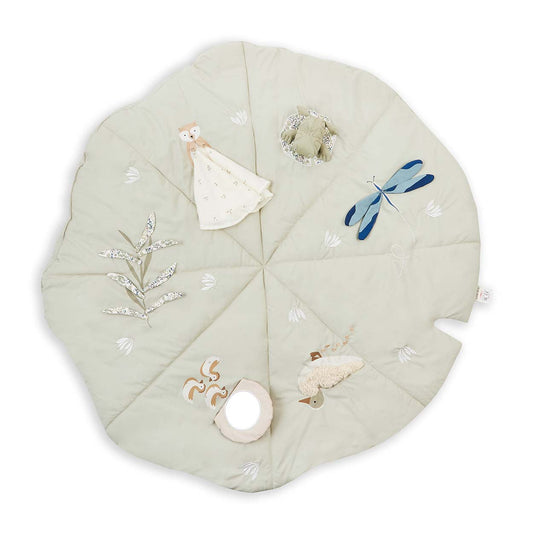 Round quilted baby mat with embroidered designs on a white background