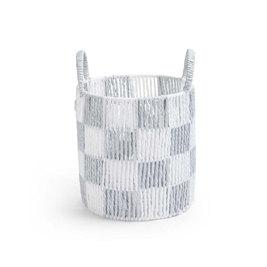 Textured woven basket with handles on a white background