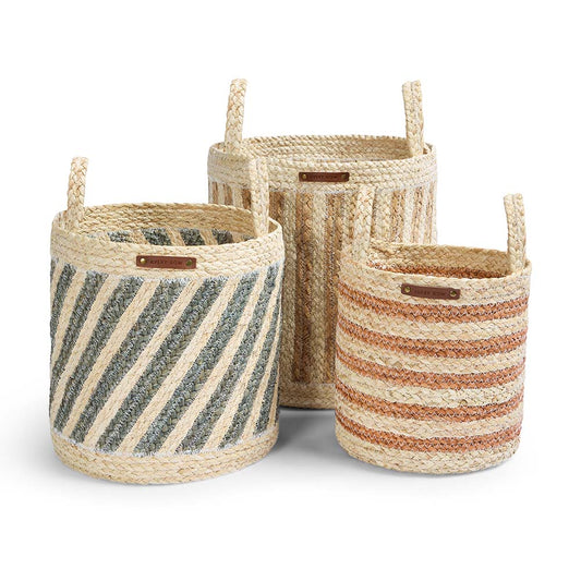 Three woven baskets with striped patterns on a white background