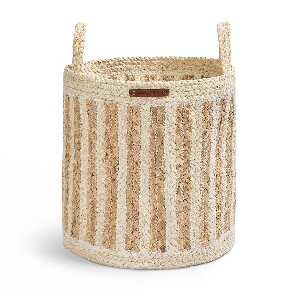 Woven basket with striped pattern and handles on a white background